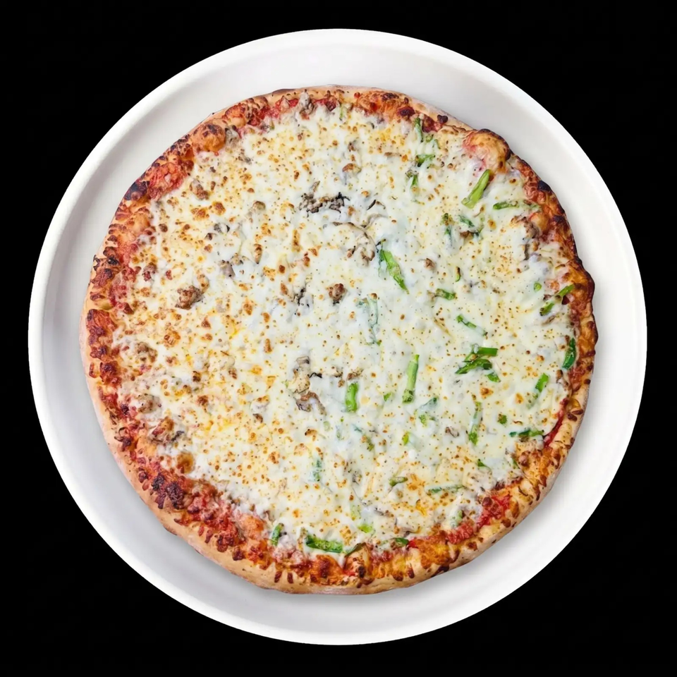 Overhead view of a whole pizza with white cheese, green peppers, and mushrooms on a white plate.